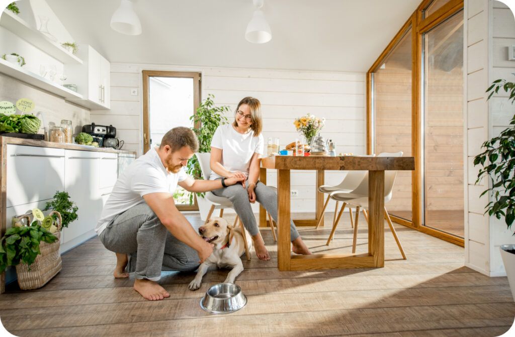 couple in kitchen with dog